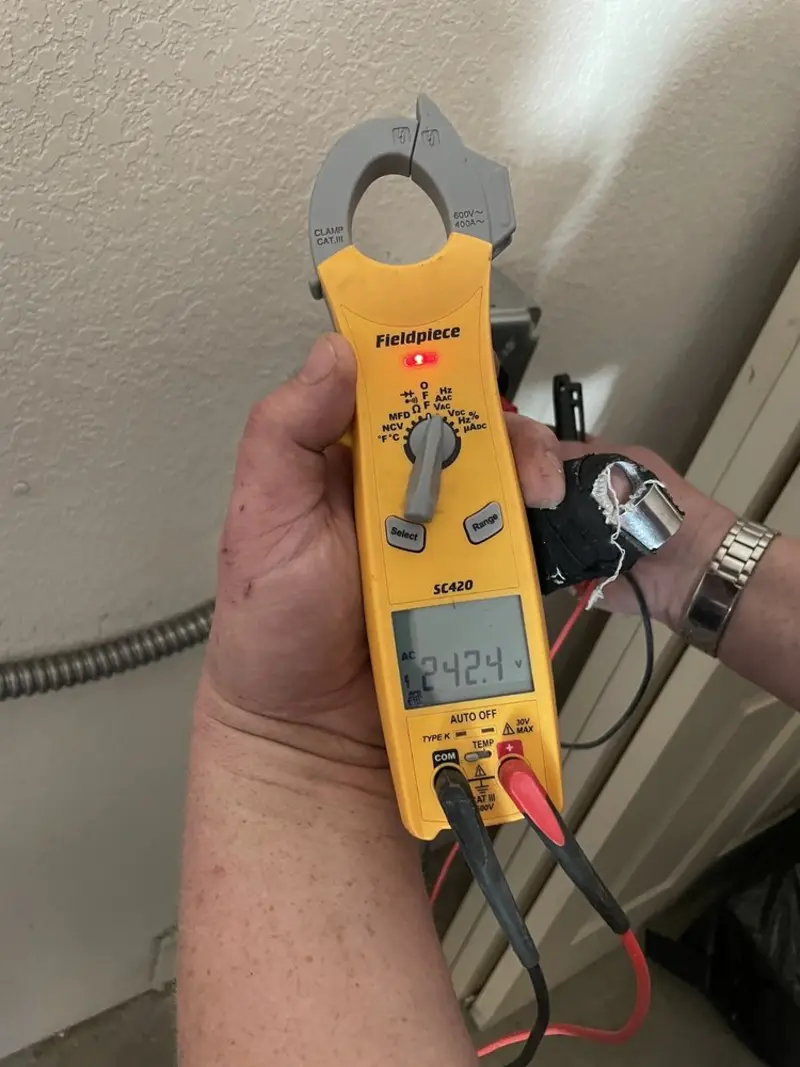 Voltage testing with clamp meter during Recessed Lighting Installation in Bristol